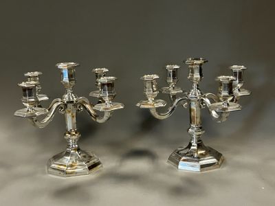 pair of silver plated candelabs with candlesticks on stands