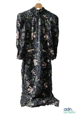 an image of a black and white floral dress hanging on a hanger
