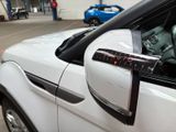 a close up of a car ' s side mirror with a sticker on it