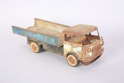 a toy truck that is sitting on a white surface