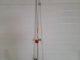 an image of a pole with a tool attached to it in front of a garage door