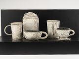 black and white photograph of a group of coffee cups and mugs