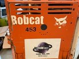 an orange machine that is sitting in the garage
