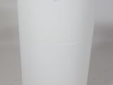 a white trash can that is sitting on a table