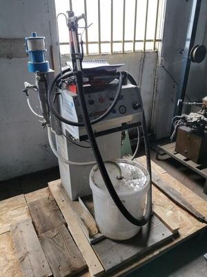 a machine that is sitting on a pallet in a room