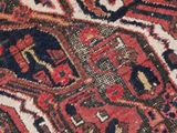 close up of a red and blue oriental rug with an elephant design on it