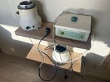 a small table with a blender and a toaster on it