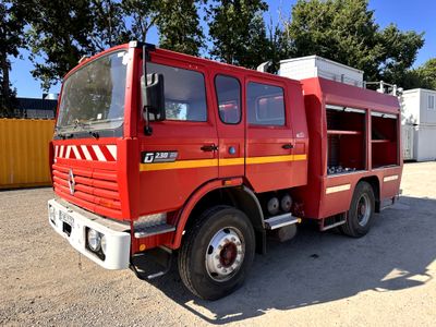 a red fire truck that is parked in a lot