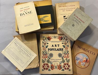 many books that are sitting on a table together
