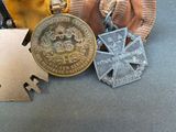 three medals and a medal are sitting on a table