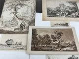several drawings of various landscapes are displayed on a table