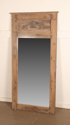 an image of a large mirror sitting on top of a wooden floor