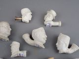 a lot of small white statues on the table