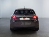 a car that is parked in a room with a white wall