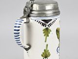 an image of a beer mug with a bird on it