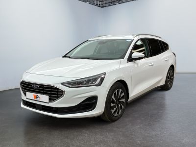 a white car is parked in a white room with a black floor