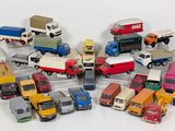 a lot of toy trucks that are sitting on a table