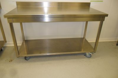 a stainless steel table with a shelf on it