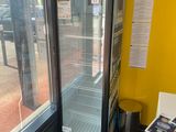 a refrigerator that is sitting in the corner of a room