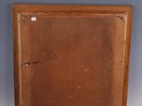 an old wooden box with a small opening on the inside