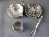 a lot of silver items that are on a table