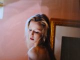 a woman that is standing in front of a mirror