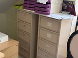 a small bedroom with a desk and a chair in it