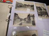 several old black and white photos of a street and buildings