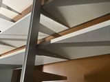 a picture of a metal staircase with white treads