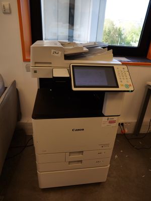a printer that is sitting in front of a window