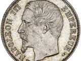 a close up of a coin with a man ' s face on it