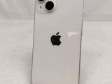 an apple iphone is sitting on a stand on a white surface