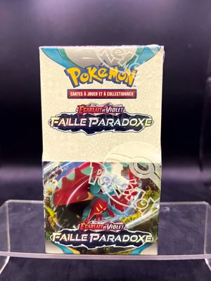 a close up of a box of pokemon cards on a table