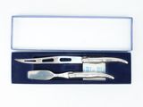 a knife, fork, and spoon in a blue box