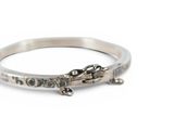sterling silver bangle bracelet with a car charm on the side