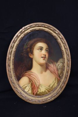 portrait of a woman in a pink dress in a gold frame