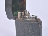 a lighter that is sitting on a white surface