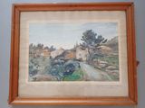 framed watercolor painting of a country road in a wood frame