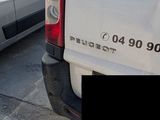 a white van that is parked in a parking lot