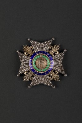a close up of a badge on a black surface