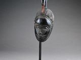 an image of a sculpture of a bird on top of a head