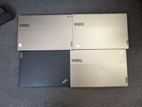 three laptops are sitting on the floor next to each other