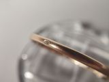 a gold ring with a diamond on top of it