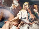 a painting of a woman laying on a bed with two other women