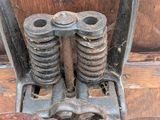 a close up view of a pair of old metal springs