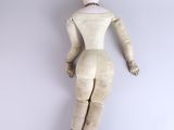 an image of a wooden mannequin laying on a white surface