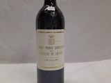 a bottle of wine that is sitting on a table