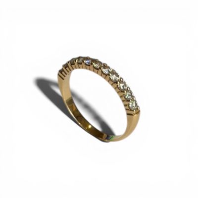 Une alliance demi américaine sertie de onze diamants taille …