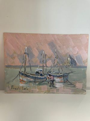 un tableau représentant un bateau, posé sur une étagère dans une pièce