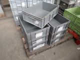 a stack of crates sitting on a pallet in a warehouse